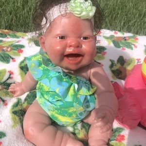 Beautiful and smiling baby doll really adorable.